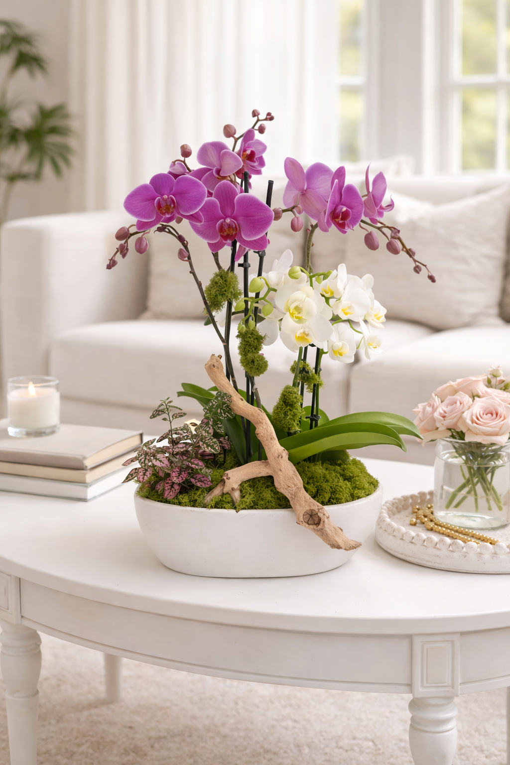 Decorative floral arrangement on a white coffee table with a blurred living room background